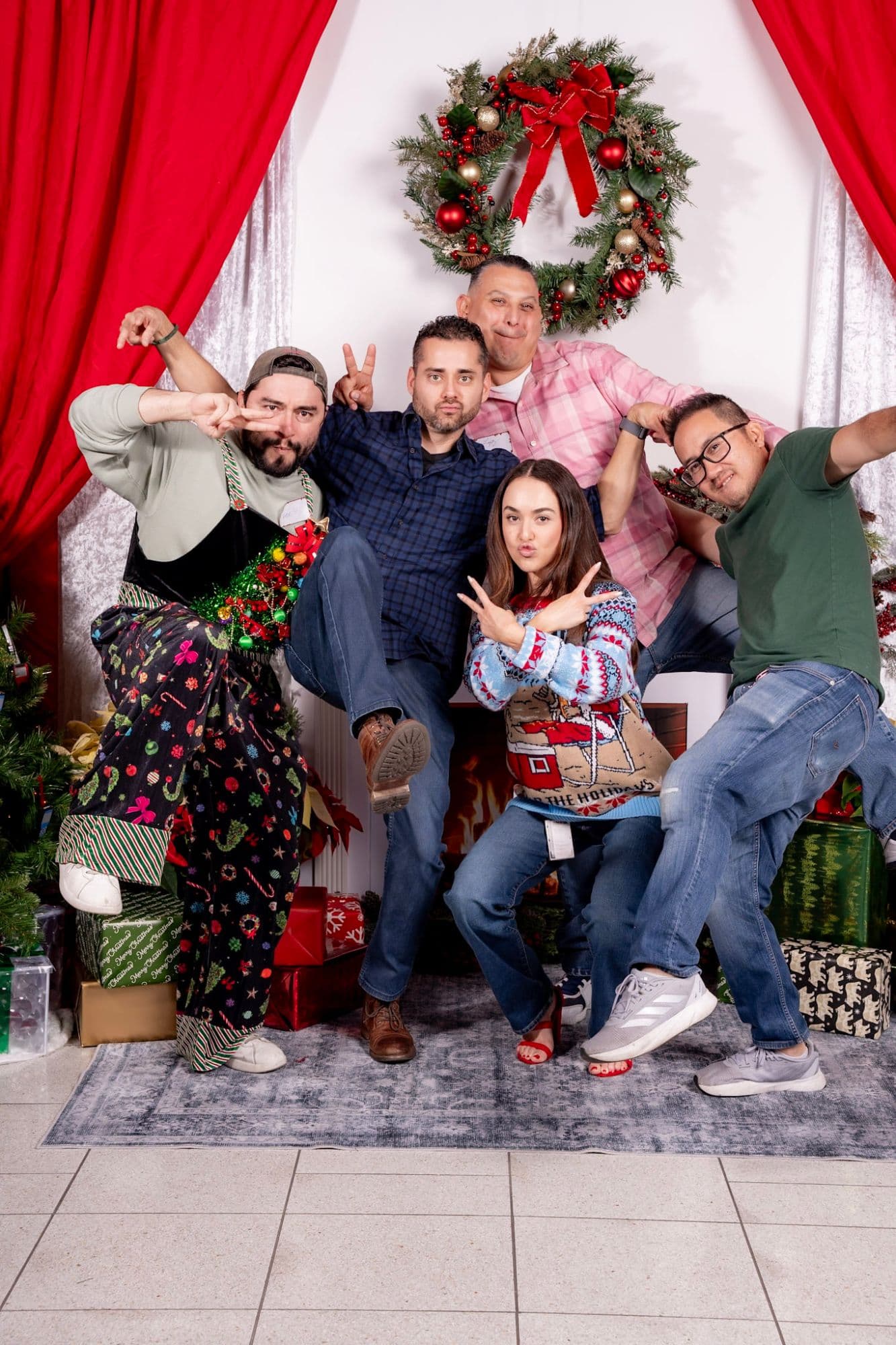 Coworkers posing together at an Orange County company holiday party